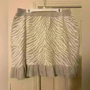 Dolan Anthropologie ruffled knit mini skirt, high waisted, ruffled trim.